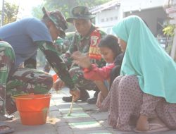 Satgas TMMD Kodim 0816/Sidoarjo dan Warga Desa Penambangan Bersatu dalam Kegiatan Pembersihan dan Pengecatan Lingkungan